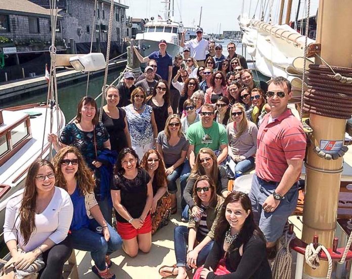 IMPORTANT WORK BUT TIME FOR FUN: Chisholm Chisholm & Kilpatrick staff lighten the mood a little with sailing in Newport on CCK Day. / COURTESY COURTESY CHISHOLM