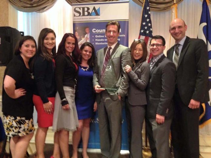 A TEAM EFFORT: TribalVision celebrates Managing Partner and CEO Chris Ciunci, center, being named Small Business Person of the Year for R.I. by the SBA. / COURTESY TRIBALVISION