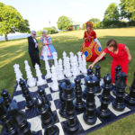 SEVERAL 2015 HEART BALL guests play Queen of Hearts lawn chess recently on the grounds of the Marble House in Newport at the fund raiser, which raised $425,000 for the American Heart Association. / COURTESY AL WEEMS