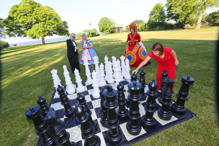 SEVERAL 2015 HEART BALL guests play Queen of Hearts lawn chess recently on the grounds of the Marble House in Newport at the fund raiser, which raised $425,000 for the American Heart Association. / COURTESY AL WEEMS