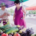 USDA grant bolsters Farm Fresh R.I.’s Bonus Bucks program Blia Moua, a grower of Asian produce, and Rachel Newman Greene, director of partnerships and community projects for West Elmwood Housing Development Corp., are seen last summer at a farmers market. Farm Fresh Rhode Island received $330,000 over a three-year period from the u.S. Department of Agriculture to double the amount of nutrition incentives distributed at farmers markets across the state. / PBN FILE PHOTO/ MICHAEL SALERNO