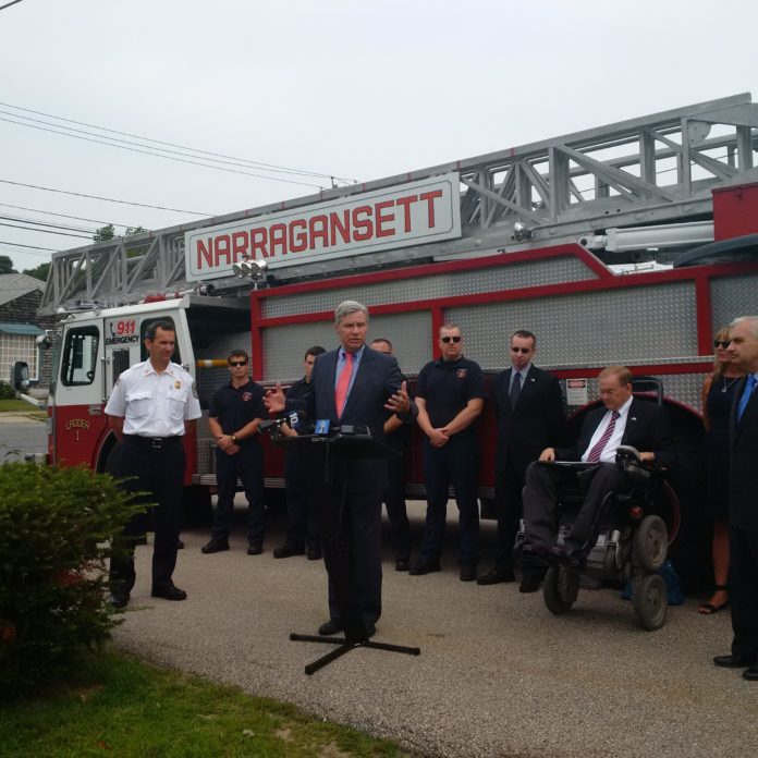 U.S. SEN. SHELDON WHITEHOUSE speaks at the Narragansett Fire Department on Monday. The department received approximately $770,000 in federal funding for a new ladder truck and firefighting equipment. On the left is Narragansett Fire Chief Scott Partington. / COURTESY OFFICE OF U.S. SEN. SHELDON WHITEHOUSE