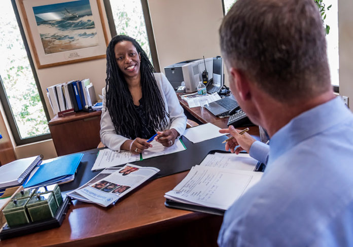 A NEW MODEL: Dr. Nicole Alexander-Scott, Rhode Island's newly appointed health director, meets with acting Chief of Staff Steven Boudreau. Alexander-Scott said she is working to find 