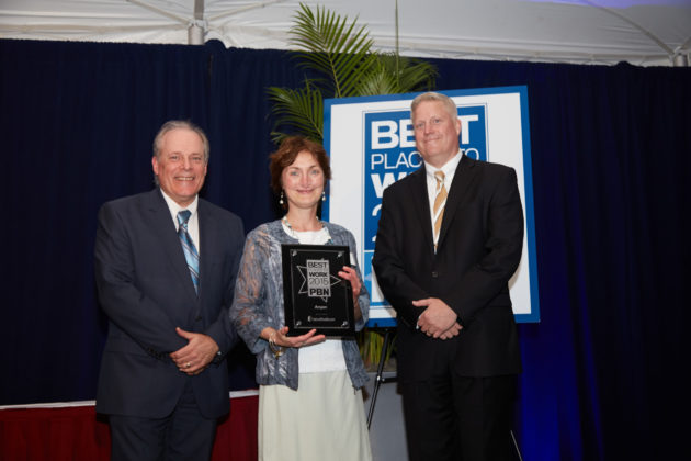Amgen&rsquo;s Kathleen Sprague accepts the ward for the Enterprise Category / Photography by Casey