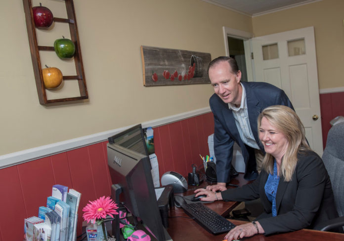 APPLE OF THEIR EYE: Apple Valley Insurance owners Nancy R. Mendizabal and her brother, David A. Brush, are the second generation to lead the family business, which was founded in 1962. / PBN PHOTO/MICHAEL SALERNO