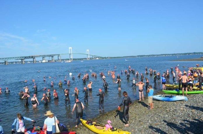 FIGHTING A STRONG TIDE:  The Great Recession led to layoffs at Save The Bay, putting more pressure on the nonprofit's revenue streams, including the Save The Bay Swim. The 2015 edition, held July 11, had swimmers navigate the Narragansett Bay from the Naval War College to Potter Cove in Jamestown, raising $26,162. Despite it being the organization's largest fundraiser, the swim is not enough to keep Save The Bay from increasing efforts to grow and diversity its revenue stream. / COURTESY SAVE THE BAY