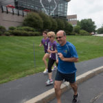UP TO SPEED: Through a series of wellness, nutritional and fitness initiatives, CVS Health has a healthier workforce, and a better handle on health care costs. Employees training for the CVS Downtown 5K at company headquarters in Woonsocket are, from left, Sheila Bowe, and Carmen and Les Steinbrecher / PBN PHOTO/MICHAEL SALERNO