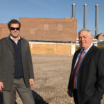 MATT FAIR, left, and Peter Hayes, brokers with Hayes & Sherry, are seen at the site of the former Victory Plating Co. in this file photo from 2013. The 5.3-acre Victory Place site on Eddy Street has been purchased by Rhode Island Hospital. / PBN FILE PHOTO/BRIAN MCDONALD