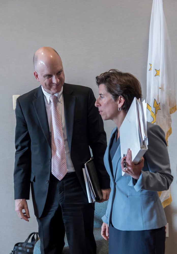 Ken Wagner, commissioner of elementary and secondary education, is shown speaking with Gov. Gina M. Raimondo. Wagner said the AP and SAT results recently released show that Rhode Island students recognize the importance of preparing for college. / PBN FILE PHOTO/ MICHAEL SALERNO