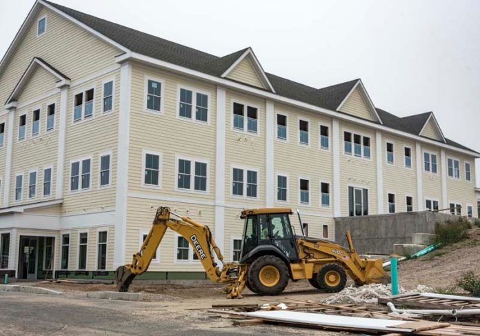 CONSTRUCTION IS under way at The Village at South County Commons. This 22,000-square-foot, three-story office
building will be an addition to the existing development of buildings. The Providence-Warwick metropolitan area lost 2 percent of construction jobs in July compared with July 2014. / PBN FILE PHOTO/ MICHAEL SALERNO