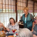 GOOD SERVICE: Village Haven restaurant owner Rachel C. Narodowy, standing, speaks with patrons, from left: Jack Polacek, Rebecca O'Bar and Mike O'Bar. / PBN PHOTO/TRACY JENKINS