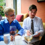 ON THE MENU: Stephen Willson, right, front-of-the-house manager for Gracie's restaurant in Providence, reviews scheduling for a new corporate-outings program with consultant Val Littlefield. / COURTESY  JWESSEL  PHOTOGRAPHY FOR GRACIE'S PROVIDENCE