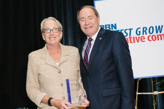 Katharine Flynn and Dr. David Dooley accept the award for the URI Business Engagement Center / Rupert Whiteley