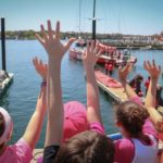 SPECTATORS IN the Volvo Ocean Race Village watch one of the race boats leave the dock. / COURTESY VOLVO OCEAN RACE/CARMEN HIDALGO
