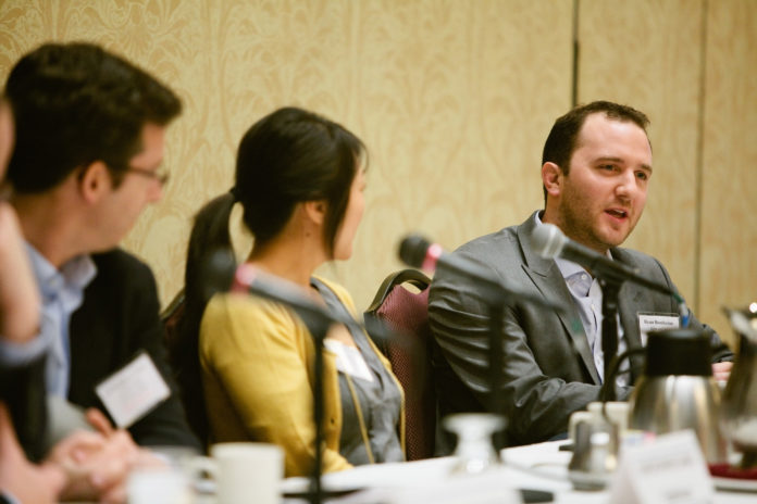 RYAN BONIFACINO, senior vice president digital at Alex and Ani, right, is leaving the company to pursue his MBA. He is pictured in a file photo from a Providence Business News summit. / PBN FILE PHOTO/RUPERT WHITELEY