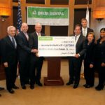 DELTA DENTAL of Rhode Island is giving more than $1 million in five separate donations to professionals to support critical oral health care across the state. Pictured, from left to right., Neil D. Steinberg, president and CEO of The Rhode Island Foundation; U.S. Sen. Jack F. Reed; Dr. Timothy J. Babineau,  president and CEO of Lifespan; Joe Nagle, president and CEO of Delta Dental of Rhode Island; Raymond Lavoie, executive director of Blackstone Valley Community Health Care; Chuck Jones, president/CEO of Thundermist Health Center; Elaine Hardman, chief operating officer of Providence Community Health Centers; Dr. Latha Sivaprasad, senior vice president of medical affairs and chief medical officer at Rhode Island Hospital and Hasbro Children's Hospital; John Marchant, president of the Scituate Health Alliance and Dr. Elizabeth G. Benz, director of the Samuels Sinclair Dental Center. / COURTESY DELTA DENTAL OF RHODE ISLAND