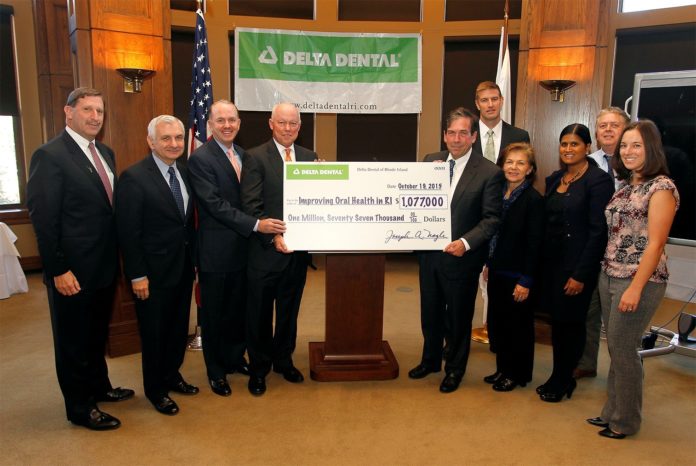 DELTA DENTAL of Rhode Island is giving more than $1 million in five separate donations to professionals to support critical oral health care across the state. Pictured, from left to right., Neil D. Steinberg, president and CEO of The Rhode Island Foundation; U.S. Sen. Jack F. Reed; Dr. Timothy J. Babineau,  president and CEO of Lifespan; Joe Nagle, president and CEO of Delta Dental of Rhode Island; Raymond Lavoie, executive director of Blackstone Valley Community Health Care; Chuck Jones, president/CEO of Thundermist Health Center; Elaine Hardman, chief operating officer of Providence Community Health Centers; Dr. Latha Sivaprasad, senior vice president of medical affairs and chief medical officer at Rhode Island Hospital and Hasbro Children's Hospital; John Marchant, president of the Scituate Health Alliance and Dr. Elizabeth G. Benz, director of the Samuels Sinclair Dental Center. / COURTESY DELTA DENTAL OF RHODE ISLAND