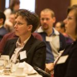 ENGAGED AUDIENCE: Linda Fish, left, director of information security at Blue Cross & Blue Shield of Rhode Island, listens to a panel discussion during last week's Cybersecurity Summit. / PBN PHOTO/ RUPERT  WHITELEY