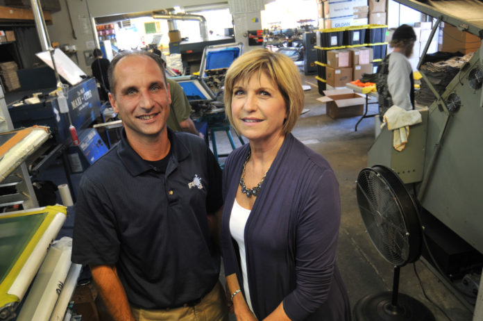 FAMILY BUSINESS: Nelson Silva and Hilda Allienello of Graphic Ink, an East Providence firm specializing in screen printing, embroidery and design. / PBN PHOTO/FRANK MULLIN