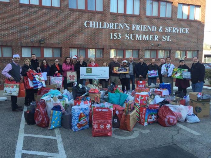 THEY DELIVER: Panera Bread employees help with the distribution portion of the December 2014 Children's Friend annual holiday drive. / COURTESY CHILDREN'S FRIEND