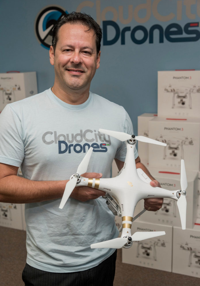 ON THE FLY: Christopher Williams, owner of Cloud City Drones in Warwick, holds a Phantom 3 drone. / PBN PHOTO/MICHAEL SALERNO