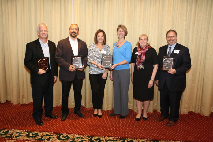 HOLDING THE Employer of Choice awards that they received at a recent event  sponsored by the Employers Association of the NorthEast, from left to right, are: Brian Plummer, vice president of manufacturing in Rhode Island for Cadence; Omar Ferretti, vice president of manufacturing in Massachusetts for Cadence;  Eileen Madigan, U.S. organizational development manager for Bemis Associates; Jennifer Evans, human resources administrative assistant for Bemis Associates; Meredith Wise, president of the Employers Association of the NorthEast; and Charlie D'Amour, president and chief operating officer of Big Y Foods. / COURTESY EMPLOYERS ASSOCIATION OF THE NORTHEAST