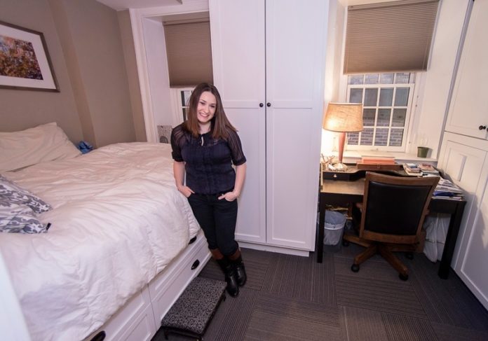 Corey Towner stands in her micro-loft located on the second floor of the Arcade Providence. A new neighborhood association has formed to represent the interests of downtown Providence residents. / PBN PHOTO/MICHAEL SALERNO