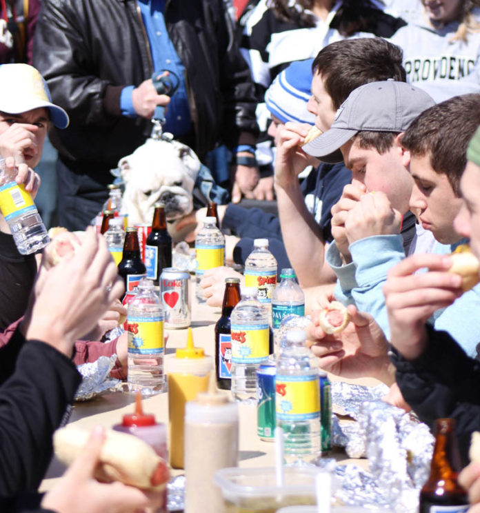 HAIRY DEBATE: Hot dog enthusiasts, including Spike the bulldog, take part in a hot dog eating contest at Providence College in 2011. Whether a hot dog can be considered a sandwich is a matter of debate for some. / COURTESY SPIKE'S JUNKYARD DOGS