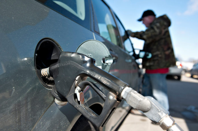 RHODE ISLAND and Massachusetts gas prices continue to drop, AAA Northeast said.  / BLOOMBERG FILE PHOTO/DANIEL ACKER