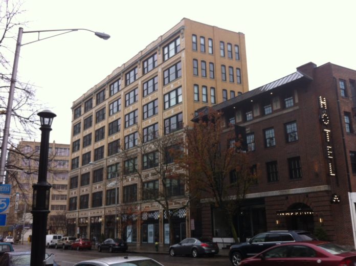 The Palmer Block, or Cosmopolitan building, at 100 Fountain St. in Providence, center, is one of four historic redevelopment projects that had received property tax incentives from the city more than a decade ago. / PBN PHOTO/MARY MACDONALD