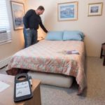GUEST  QUARTERS: Cranston Airbnb host Eric Weiner readies one of two rooms he rents to travelers. / PBN PHOTO/ MICHAEL  SALERNO