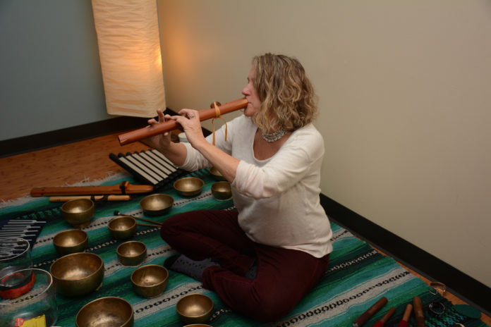 Rosie Warburton, a licensed massage therapist and sound therapist, plays music for cancer patients. / Courtesy Women & Infants Hospital/Care New England