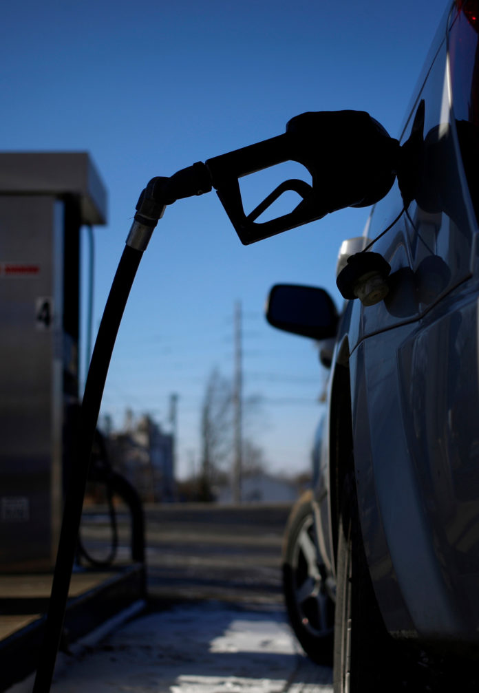 THE PRICE OF GASOLINE continued its drop in Rhode Island and Massachusetts, as oversupplies and seasonal declines in demand press the price at the pump in the region down.  / BLOOMBERG NEWS FILE PHOTO/LUKE SHARRETT