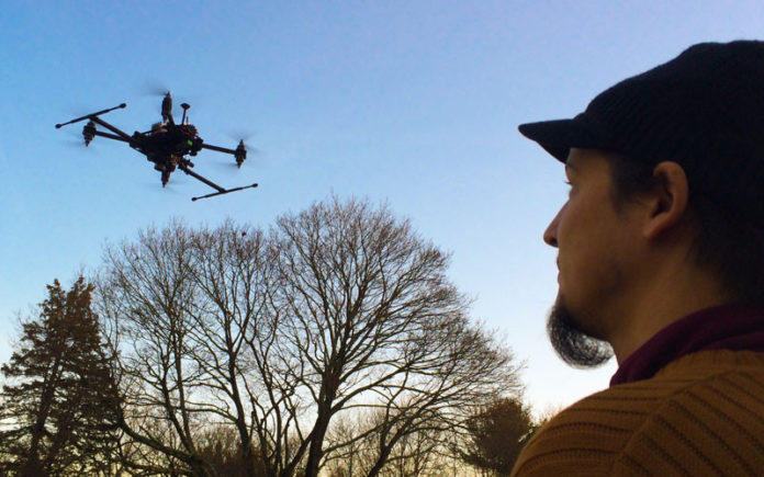 HIGH ASPIRATIONS: Andy Trench, CEO of Warwick-based XactSense Inc., flies a drone carrying a lightweight laser scanner. / COURTESY XACTSENSE