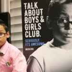 Dennis Martinez, 10, of Pawtucket, stands next to a likeness featured in a new print ad for a Rhode Island Boys & Girls Club ad campaign. / COURTESY DOUG CUDDEBACK/DUFFY & SHANLEY