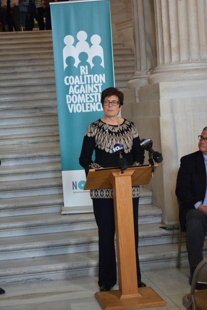 Deborah DeBare, executive director of the Rhode Island Coalition Against Domestic Violence, speaks at the organization’s press conference at the Statehouse late last month. / COURTESY KRISTA D’AMICO