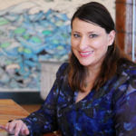 CATERING TO CHILDREN: Krysten Callina, founder and CEO of Mastermind Adventures LLC, is seen in the spacious, shared work space at Goundworks in New Bedford. / PBN PHOTO/MICHAEL SALERNO