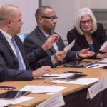 OVERHAUL NEEDED? City licensing board members, from left, Chairman Juan M. Pichardo, Luis Peralta and Johanna Harris, review photos at a recent hearing. / PBN PHOTO/ MICHAEL SALERNO