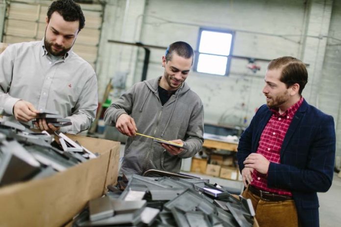 KEY PARTS OF A WHOLE: From left, account manager Taylor Kenney, production manager Jesse Godin and Custom Design Vice President Adam Dias are seen at the North Kingstown company. / PBN PHOTO/RUPERT WHITELEY