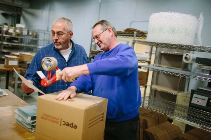ALL IN THE TIMING: From left, Ed Paradise, production manager, and Randy Broyles, shipper, ready an order at Epec Engineering Technologies. / PBN PHOTO/RUPERT WHITELEY