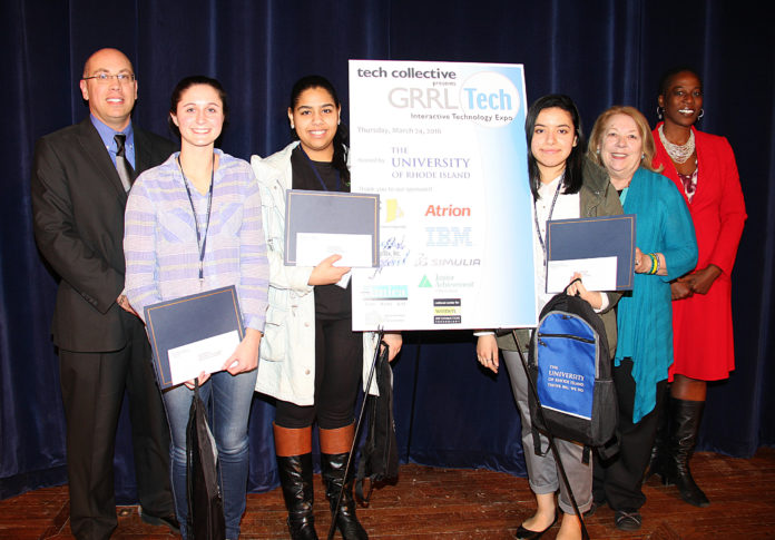 Three students were awarded 2016 GRRL Tech scholarships, receiving $4,000 per year for four years. From left to right, Dean Libutti, vice provost for enrollment management at the University of Rhode Island, stands next to scholarship winners Sophie Girard, of North Kingstown High School; Yanelly Tejada, of The Greene School; and Viviana Barrientos, of William Davies Career and Technical High School. JoAnn Johnson, Tech Collective’s manager of youth and education programs; and Naomi Thompson, associate vice president for the Office of Community, Equity and Diversity at URI, also are shown in the photograph, taken at the GRRL Tech expo on March 24 at URI. / COURTESY TECH COLLECTIVE