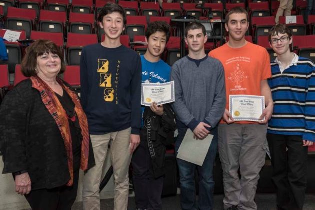 FAST AND ACCURATE: From left, URI Dean of Arts &amp; Sciences Winifred Brownell and Barrington High School winners Conor McGartoll, Jonny Zhang, Andrew Sheinberg, Michael Lamontagne and Daniel Sheinberg. / COURTESY URI/MICHAEL SALERNO