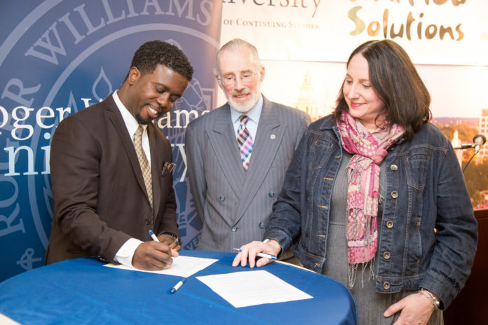 KOBI DENNIS of Unified Solutions, President Donald Farish of Roger Williams University and Dean of RWU School of Continuing Studies Jamie Scurry sign a memorandum of understanding to solidify their partnership incubator agreement which will create a direct pipeline for hundreds of inner city youth and adults to professional development and career opportunities. / COURTESY ROGER WILLIAMS UNIVERSITY
