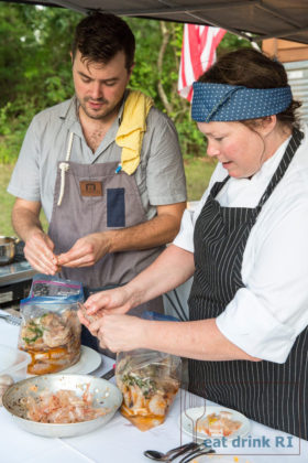 PEEL AND EAT: Chef Chris Kleyla and cook Sonya Cote peel shrimp at a Rhode Island roundup dinner last year organized by Eat Drink RI. / COURTESY SAM GLYNN