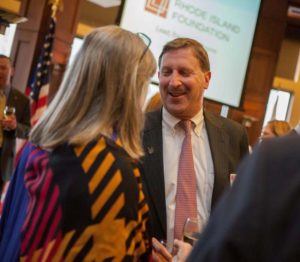 MEET AND GREET: Rhode Island Foundation President & CEO Neil D. Steinberg talks to a guest at a 2014 reception welcoming new donors. / PBN FILE PHOTO/MICHAEL SALERNO