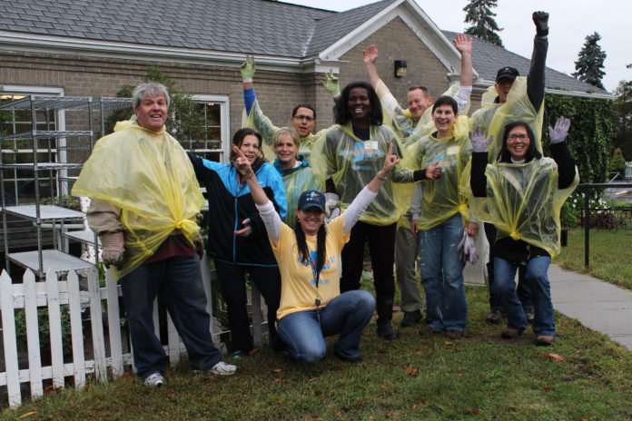 Rainy weather didn’t dampen BlueAngel volunteers’ high spirits: This group volunteered at the Groden Center during last year’s Blue across Rhode Island, Blue Cross Blue Shield of Rhode Island’s annual day of community service. / RIVERZEDGE ARTS