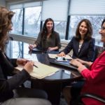 A REWARDING TEAM APPROACH: June Landry, second from right, principal and chief marketing officer for Kahn, Litwin, Renza & Co., says she learns something new every day from her team, which includes from left, Kathleen Leavenworth, Katherine Trifero and Ashley Brown. / PBN PHOTO/RUPERT WHITELEY