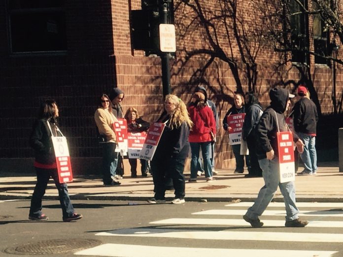 VERIZON WORKERS were protesting last month at 155 Westminster St. outside of a Verizon call center in Providence. Verizon Communications Inc. and its two unions reached an agreement in principle on a new labor contract, the U.S. Labor Department said Friday. / PBN PHOTO/ELI SHERMAN