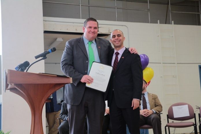 WEST BROADWAY Middle School Principal William Black stands with Providence Mayor Jorge O. Elorza during a surprise ceremony in which Black was named the 2016 Outstanding First-Year Principal of the Year. / COURTESY RHODE ISLAND ASSOCIATION OF SCHOOL PRINCIPALS