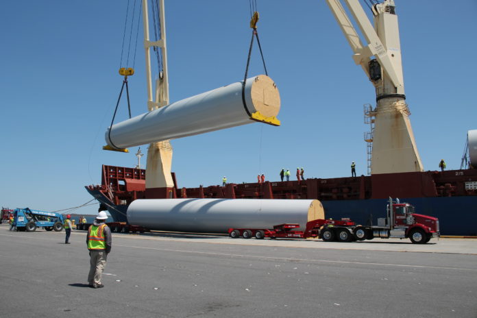 TEN land-based windmill turbines and 30 of their accompanying blades arrived at the Port of Davisville at Quonset Business park on Wednesday from Germany. Each tower consists of three large cylinders weighing between 40-60 tons each. / COURTESY QUONSET DEVELOPMENT CORP.